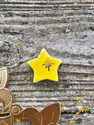 Fève en porcelaine thème magie : l'étoile magique